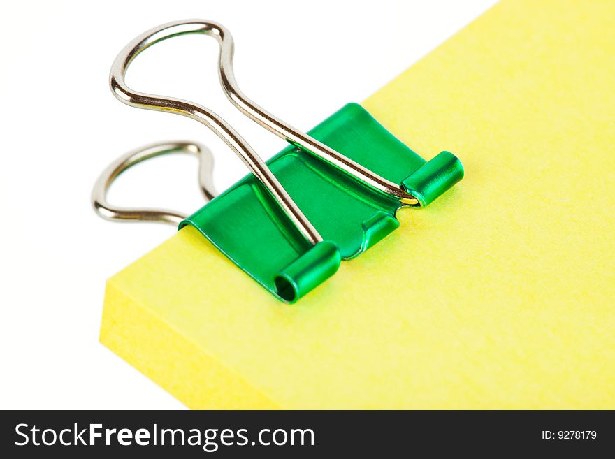 Note paper and clip isolated on white background