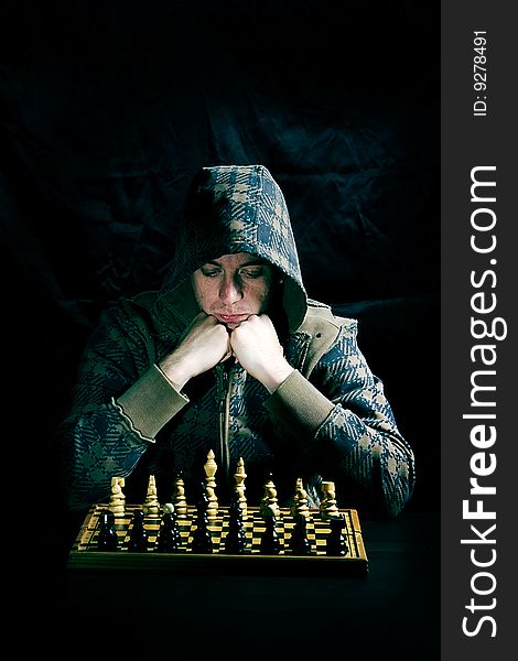 Chess player thinking over his move. Chess player thinking over his move
