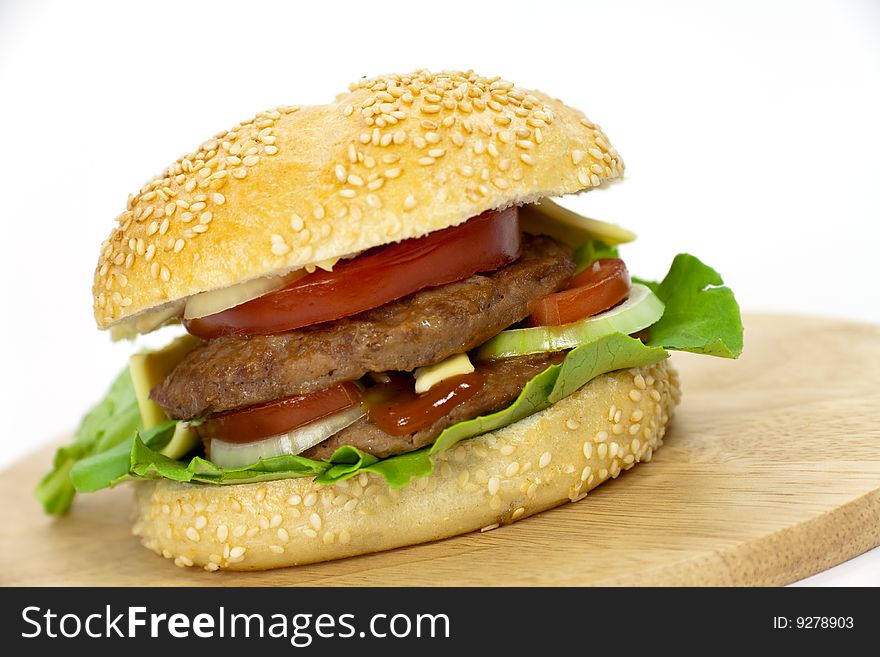 Hamburger with lettuce,cheddar,tomato.