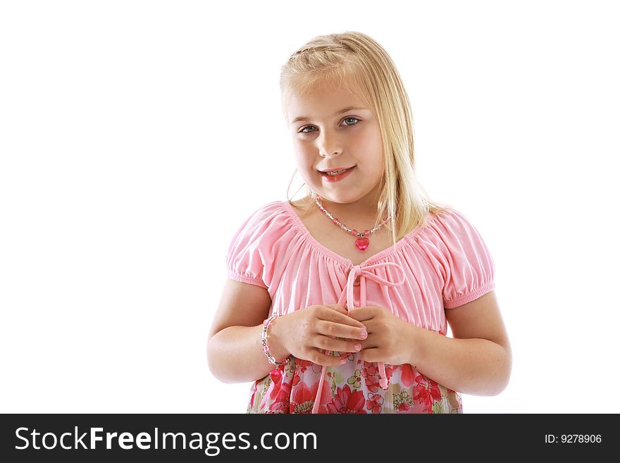 Cute little girl wearing a pink dress.