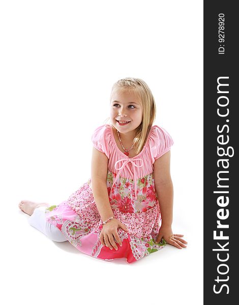 Cute little girl wearing a pink dress.
