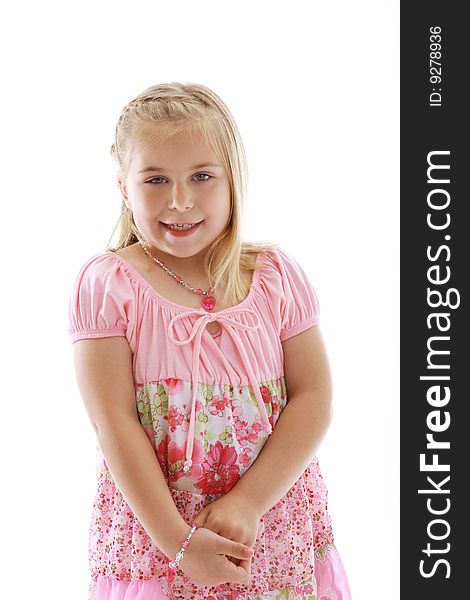 Cute little girl wearing a pink dress.