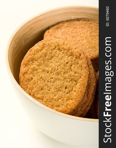 Ginger cookies in white bamboo bowl. Ginger cookies in white bamboo bowl