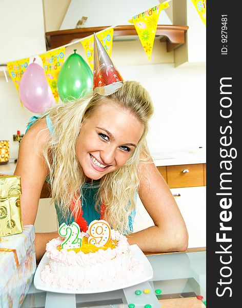 Portrait of a happy blond girl celebrating birthday