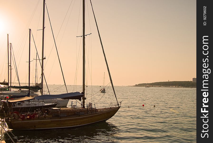 Marine yachts at a pier. Sunset soft lighting.