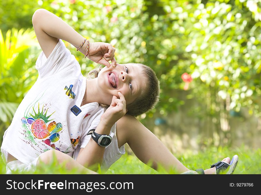 Portrait of little boy having good time in summer environment. Portrait of little boy having good time in summer environment