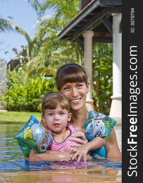 Portrait of young attractive woman having good time with her daughter. Portrait of young attractive woman having good time with her daughter