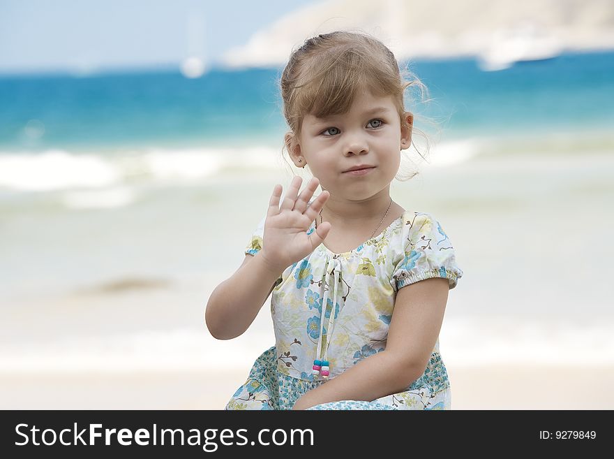 Portrait of nice little girl having fun on the beach. Portrait of nice little girl having fun on the beach