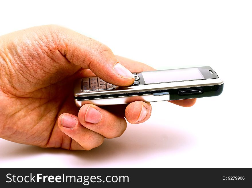 Man's hand with a mobile phone. View from side. Isolated on whiye background. Man's hand with a mobile phone. View from side. Isolated on whiye background