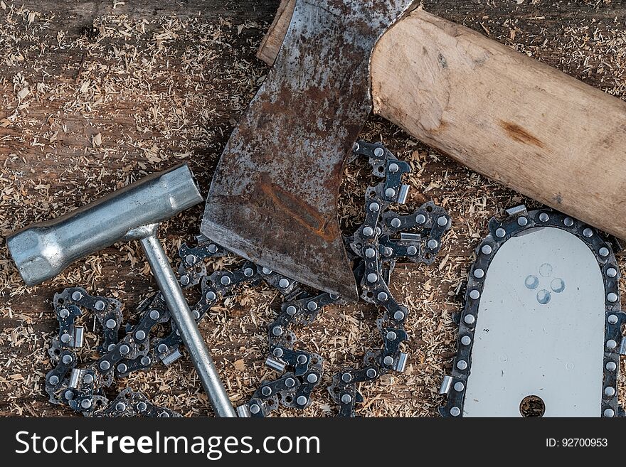Tools for cutting trees. Bus chainsaw, axe chain. Tools for cutting trees. Bus chainsaw, axe chain
