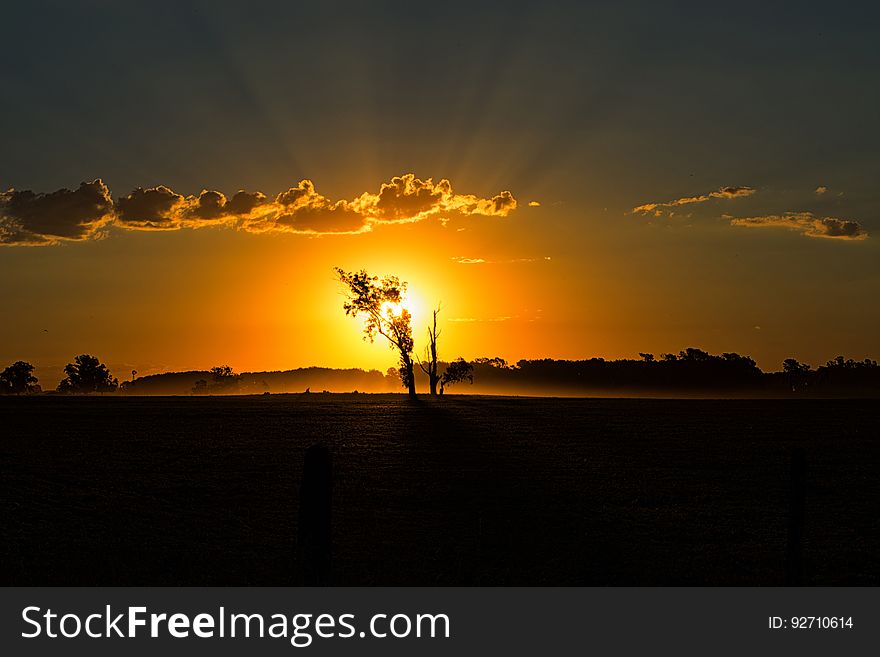 The skies with the sun setting in the horizon. backlit beautiful clouds dawn dusk field free idyllic landscape light photo scenery scenic silhouette sky stock sun sunlight sunrays sunrise sunset. The skies with the sun setting in the horizon. backlit beautiful clouds dawn dusk field free idyllic landscape light photo scenery scenic silhouette sky stock sun sunlight sunrays sunrise sunset