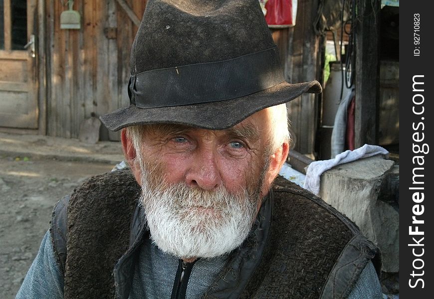 Man With White Beard Wearing Black Hat during Daytime