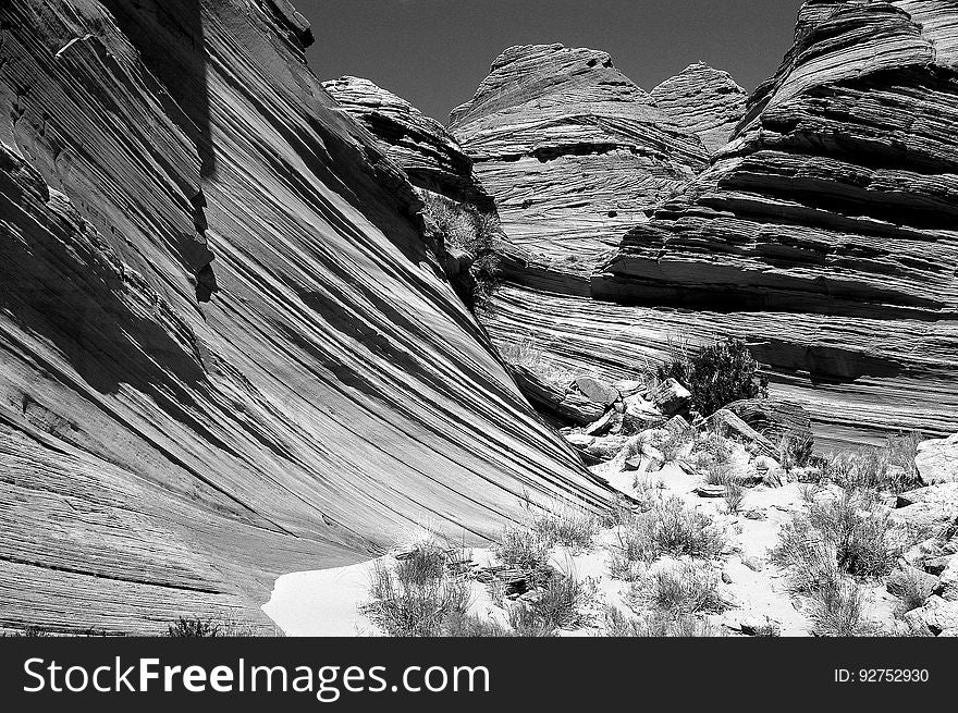 Grey Scale Photography of Rocky Mountain Grass Fields