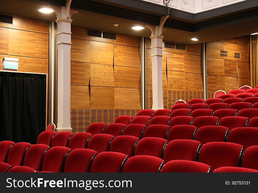Red velvet seats in an auditorium. Red velvet seats in an auditorium.