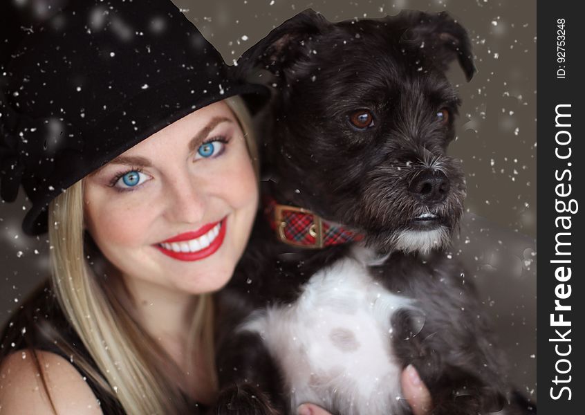Portrait of Smiling Woman With Dog in Winter
