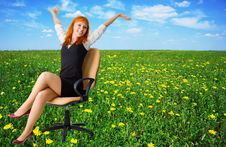 Businesswoman On A Beautiful Meadow Full Of Flower Stock Photo