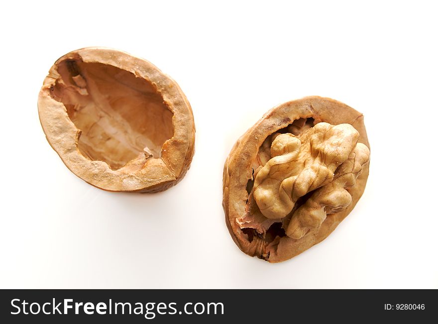 Open cracked walnut isolated on white. Open cracked walnut isolated on white
