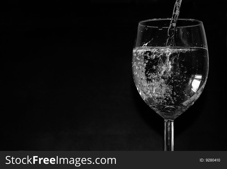 Studio shot of a glass filled with water. Studio shot of a glass filled with water