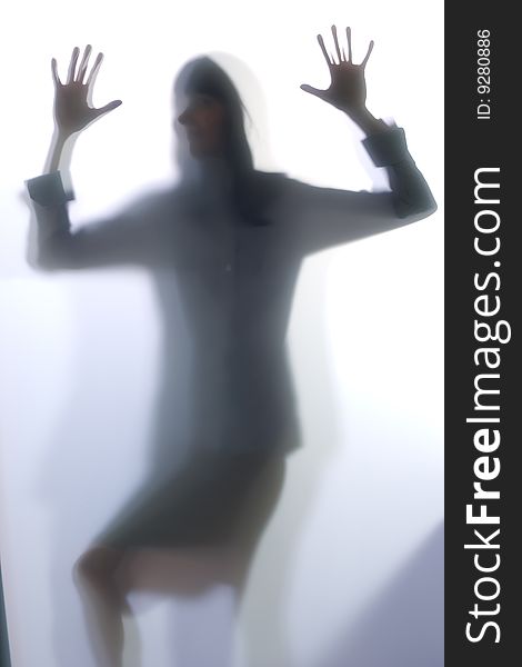 Diffused Silhouette of a womans body threw frosted glass