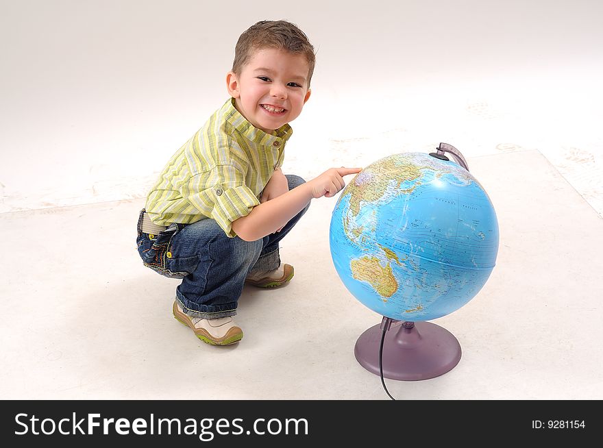 Little boy playing with globe. Little boy playing with globe