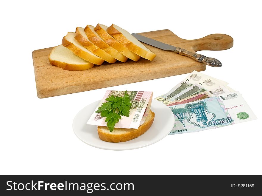 Hundred-ruble banknote and parsley leaves on a bread piece and other russian money near to a chopping board. Hundred-ruble banknote and parsley leaves on a bread piece and other russian money near to a chopping board