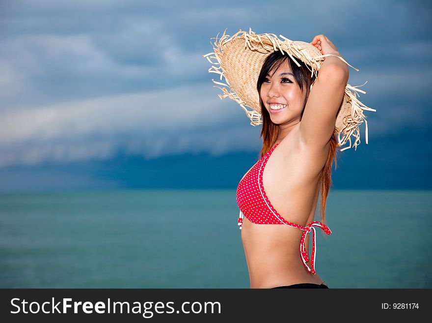 Happy young woman having fun by the beach. Happy young woman having fun by the beach