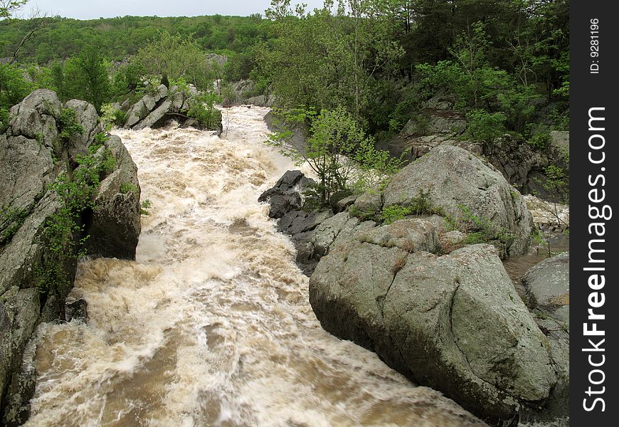 Photo of Great Falls Park rapids in Maryland on an overcast spring day. Photo of Great Falls Park rapids in Maryland on an overcast spring day.