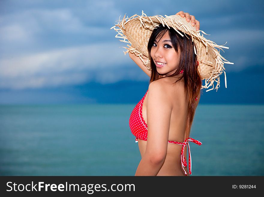 Happy young woman having fun by the beach. Happy young woman having fun by the beach
