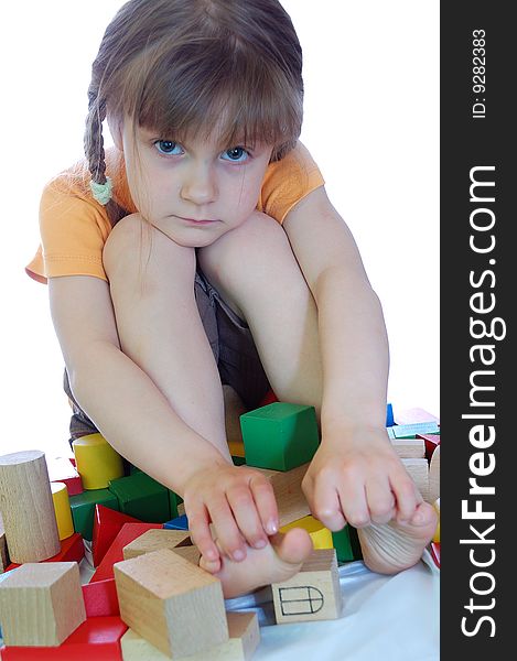 Child having a rest after playing with toy blocks