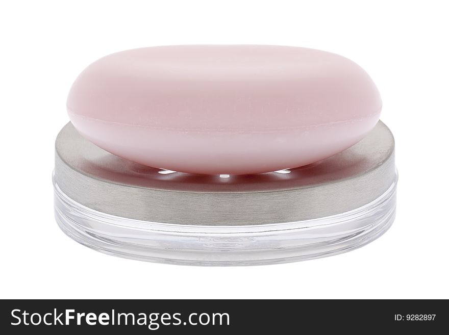 Pink soap with soap bowl, isolated against white background