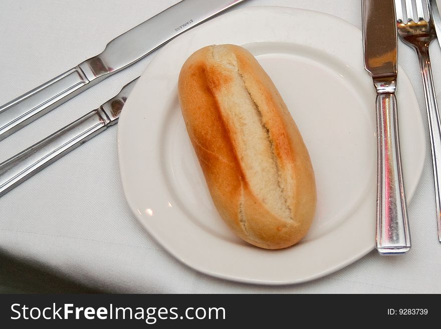 Bread on a plate with cutlery. Bread on a plate with cutlery