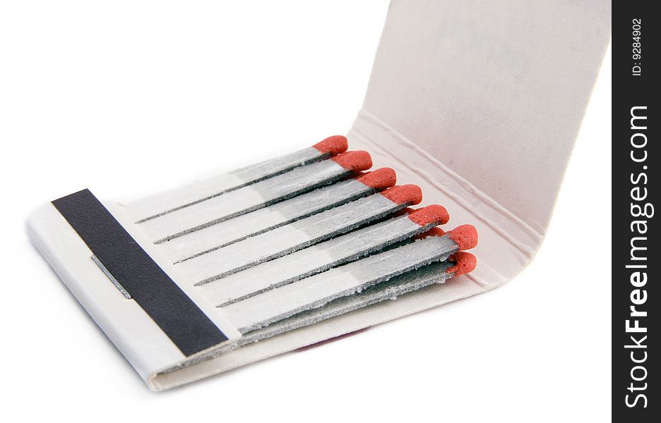 Matches and matchbox on a white background