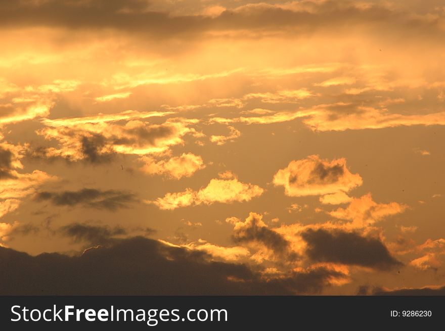 Sunset on the background of clouds