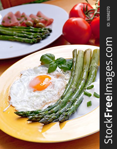 Green asparagus with fried eggs.