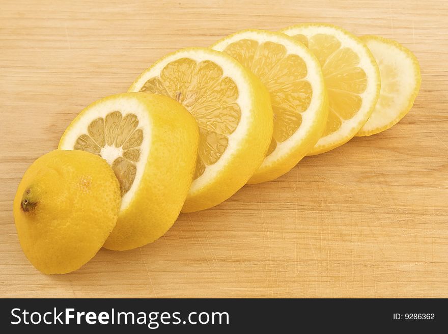 Sliced lemon on wooden background
