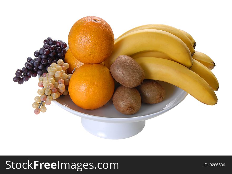 On a plate lined bananas oranges grapes kiwi. On a plate lined bananas oranges grapes kiwi