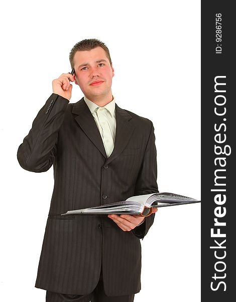 Businessman calling on cellphone, smiling