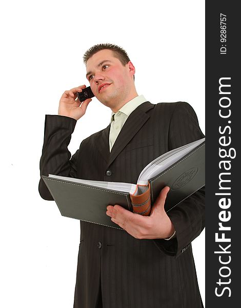 Businessman calling on cellphone, smiling
