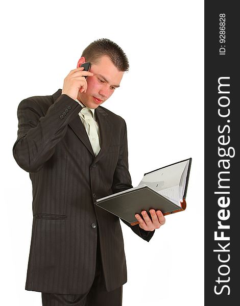 Businessman calling on cellphone, smiling