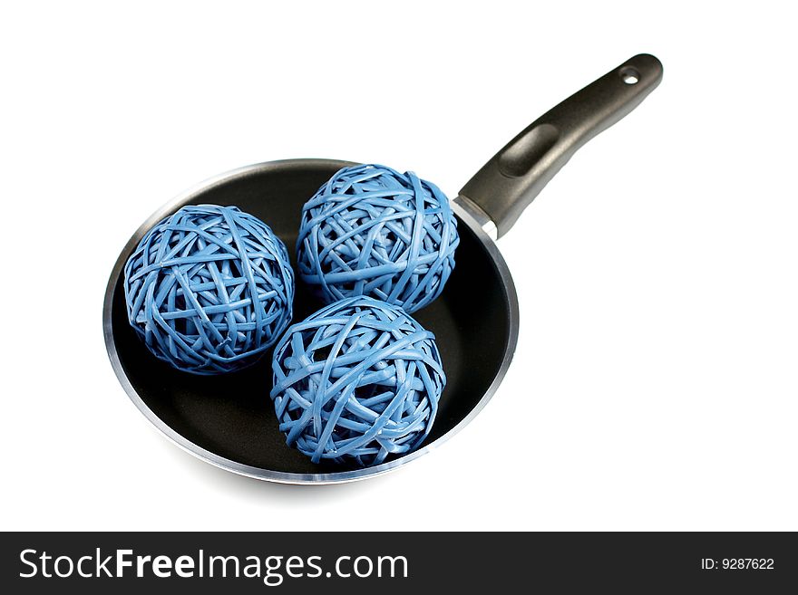 Three network blue round straws on bclack frying pan