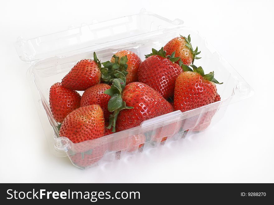 A basket of ripe strawberries on white background. A basket of ripe strawberries on white background.