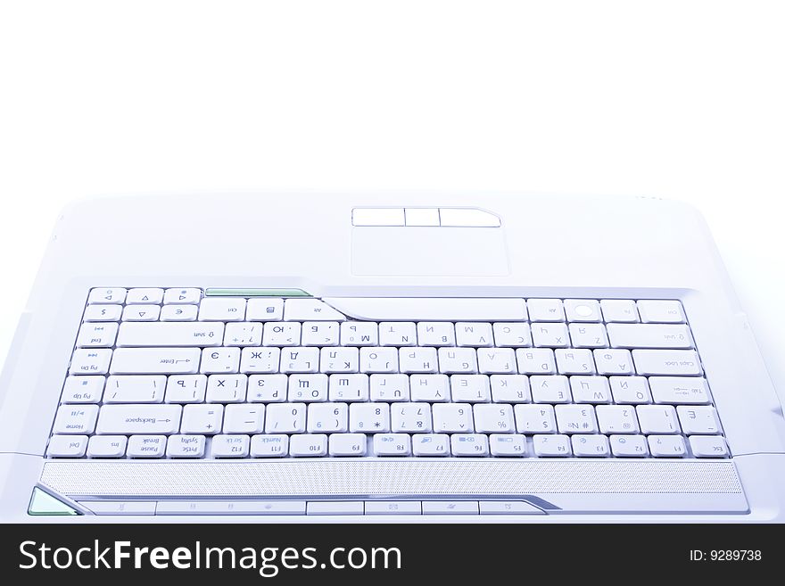 White keyboard of laptop is on the white