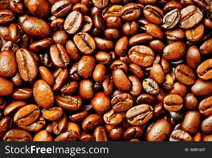 A background of roasted coffee beans.