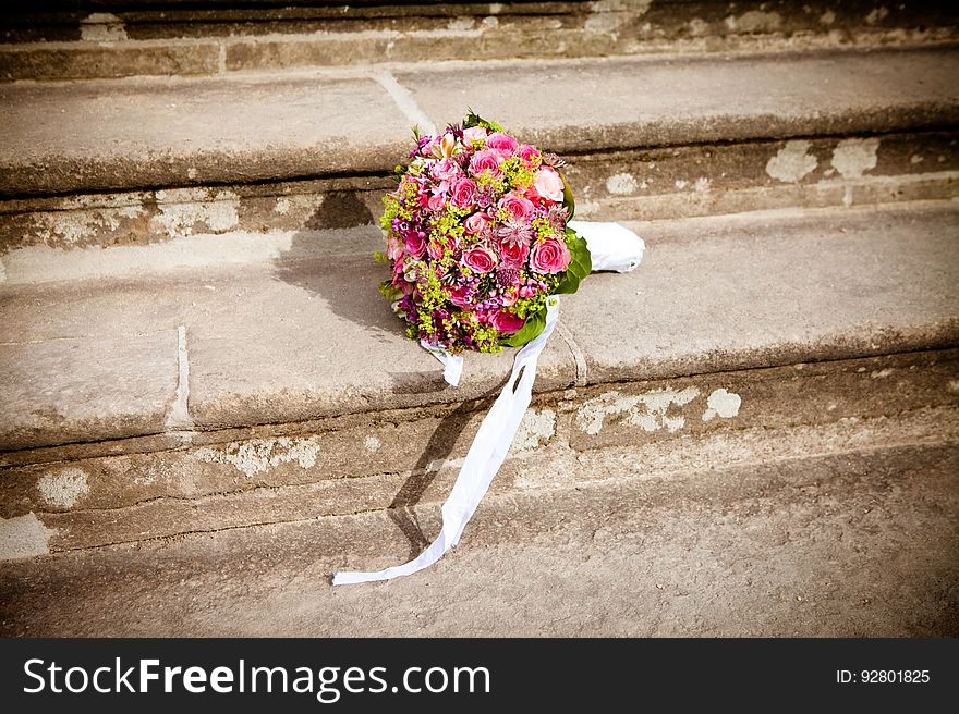 Flower Bouquet On Stairs During Daytime