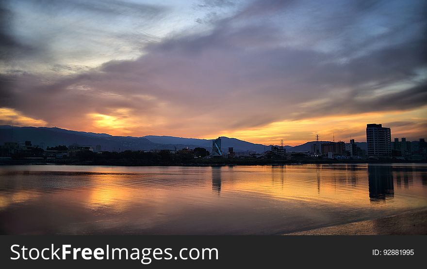 A colorful sunset over a river. A colorful sunset over a river.