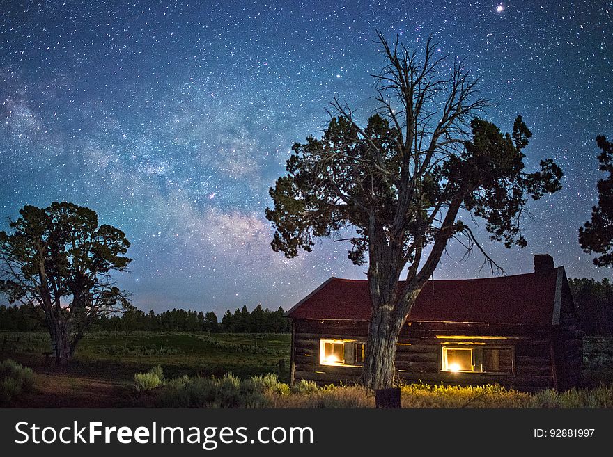 A cabin on the countryside under the stars. A cabin on the countryside under the stars.