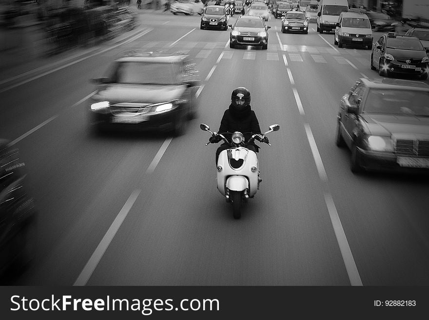 Rider on motorbike on middle lane of highway