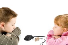 Young Boy And Girl Looking At Mouse Royalty Free Stock Photo