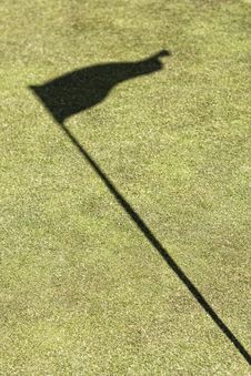 Green Golf Field Showing The Flag Shadow Stock Image