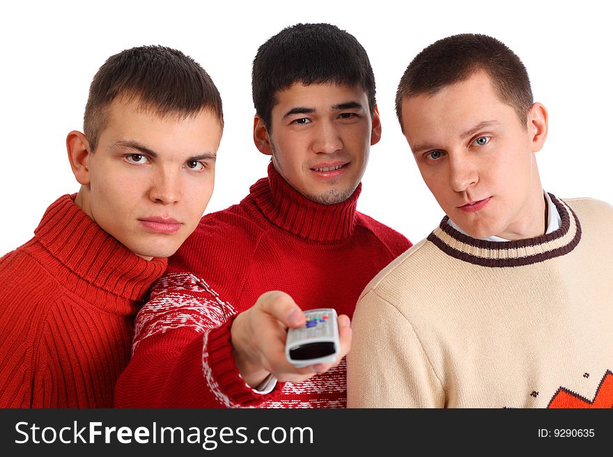 Three friends with remote control on white
